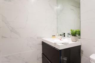 Serene and Styled Little Italy Studio full bath by Den Stays - Montréal - 3
