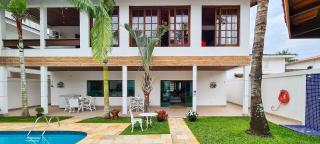 Casa com piscina, varanda e lazer em condomínio - Guarujá - 1