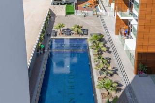Modern 1BR in Jumeirah Village Circle (Pool View) - Dubai - 4