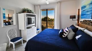 Ocean's Edge - Sip your coffee and watch the waves as you enjoy the gulf view balcony, accessible from the living room and the master bedroom condo - Dauphin Island - 5