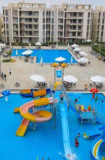 للايجار الشهري شاليه فندقي بقرية جراند هيلز الساحل الشمالي Grand Hills North Coast كود E45 - 8