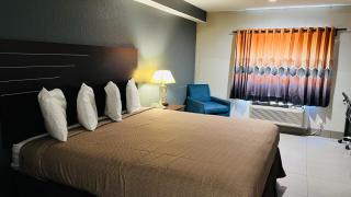 REGENCY INN & SUITS - 1