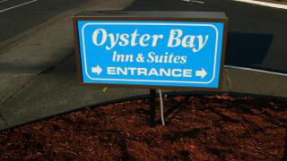 Oyster Bay Inn & Suites - 1