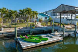 Pirates Den a 4BR Pet-Friendly Waterfront Oasis with Pool, Dock, Personal Water Boats, Fire Pit, Game Room and Bar - 0