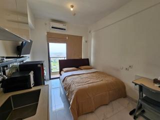 Apartement Skyhouse Bsd TL26K By LiviRooms Tangerang - Samporo - 8