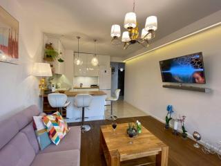 White and Bright Riverside View Flat with Parking, Bike Access, and Onsite Gym - 1