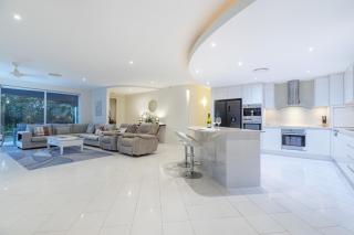Luxury resort style villa pool by Custom Bnb Hosting - Pelican Waters - 9