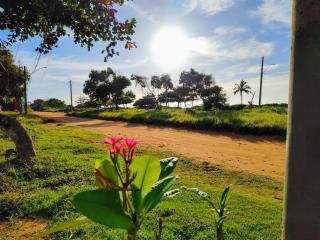 Ed Bertholi - Vista lateral do mar com garagem - 1