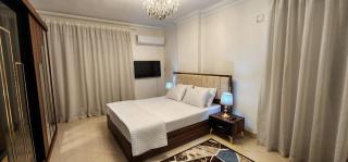 Modern Apartment in Sheraton Heliopolis, 5 minutes from Cairo Airport عمارة مطعم دجاج كنساس - 7