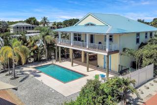 3 bed 3 bath home on quiet canal with heated and chilled pool - 0