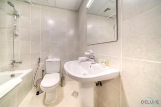 Ritzy 1BR at Global Golf Residence 2 Sports City by Deluxe Holiday Homes - Dubai - 5