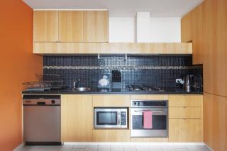 Modern Escape with Balcony & Sweeping City Views - 1