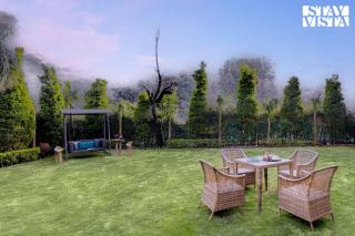 StayVista at Pandav Greens with Lawn & Bonfire - 9