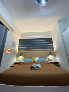 JC SpaceRentals 127B Amani Grand Resort Residences, balcony pool view, Ground floor, 5 mins frm airport, free wifi, Netflix - Pusok - 6