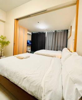 Thompson Suites - 2 beds, One Uptown Residences 28F A - XBOX & Netflix - Manila - 9