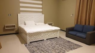 King bed room in Salalah Social club - Salalah - 8