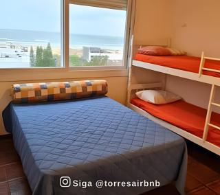 Apto em Torres com vista para mar - Menos de 200mts da praia - Ao lado das Quatro Praças - Varanda com Churrasqueira - Piscina - Smart Tv - Wifi - Vaga para 02 carros - Aceita Pet - 9
