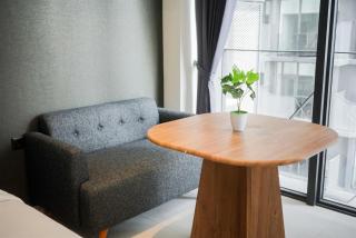 Studio Apartment with Sofa at Carstensz Residence By Travelio - 1
