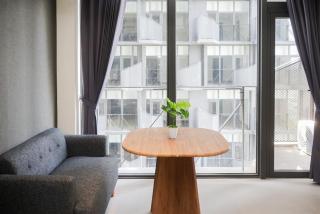 Studio Apartment with Sofa at Carstensz Residence By Travelio - 2