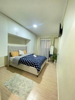 Fully furnished 2 bedroom Apartment with a Spacious balcony behind GATEWAY mall 10 Minutes to JKIA,5min to SGR with AC,washing Machine and Lift - Nairobi - 1