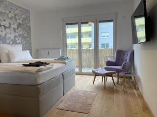 TAMLiving Graz Zentrum Balkon Küche Smart TV Ausblick - 6