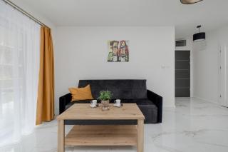 Międzywodzie Beautiful Apartment with Garden & Parking by Noclegi Renters - Międzywodzie - 3
