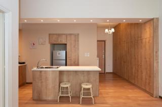 Contemporary apartment made of wood and stone. - 1