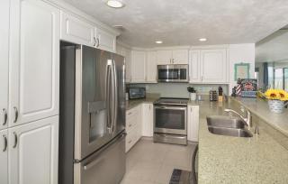Ocean Condo 104 ~ Ground Floor Corner Condo with wrap around balcony Walk right out to Pool - New Smyrna Beach - 1
