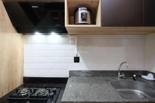 Modern Look and Comfy 2BR Transpark Cibubur Apartment By Travelio - Depok - 3