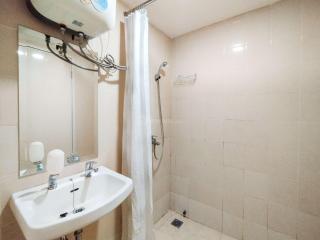 Minimalism Designed 1BR Apartment at Parahyangan Residence By Travelio - 3