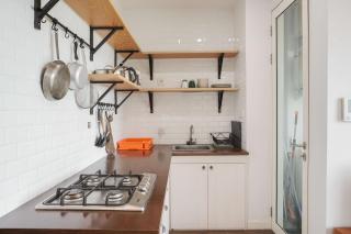 Nice and Homey 1BR at Citralake Suites Apartment By Travelio - 6