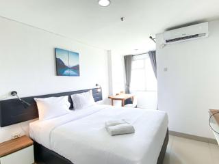 Warm and Comfy Studio at Enviro Apartment By Travelio - Cikarang - 0