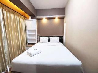 Modern Look 1BR at Uttara The Icon Apartment By Travelio - Kejayan - 6