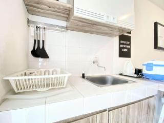 Cheerful and Homey 2BR Apartment at Parahyangan Residence By Travelio - Bandung - 1