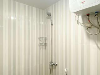 Homey and Compact Studio at Azalea Suites Apartment By Travelio - Cikarang - 4