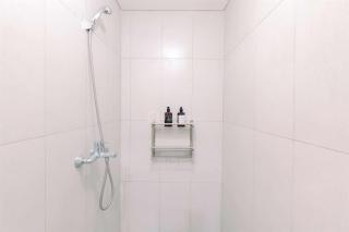 Homey and Restful Studio Royal Sentul Park Apartment By Travelio - Bogor - 9