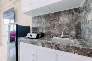Homey and Restful Studio Royal Sentul Park Apartment By Travelio - Bogor - 7
