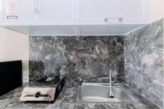 Homey and Restful Studio Royal Sentul Park Apartment By Travelio - Bogor - 5