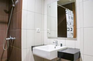 Nice and Comfy 1BR at Dago Suites Apartment By Travelio - Bandung - 5