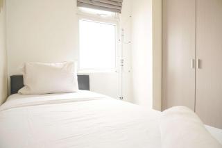 Modern and Classic 2BR at Green Pramuka City Apartment By Travelio - 9