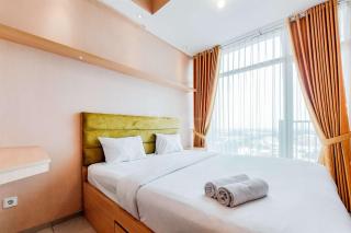 Homey and Modern Studio at Tree Park City Cikokol Apartment By Travelio - 0