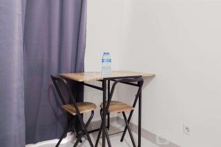 Minimalist and Homey Studio Akasa Pure Living BSD Apartment By Travelio - 9