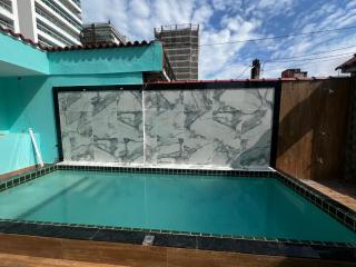 Casa à 300 metros da PRAIA com PISCINA, CHURRASQUEIRA e 2 VAGAS DE GARAGEM! - 1