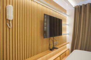 Homey Living Studio Room at Tokyo Riverside PIK 2 Apartment By Travelio - Rawalembang - 4