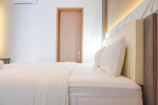 Comfort and Modern Look 2BR at 26th Floor Samara Suites Apartment By Travelio - 2