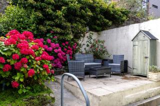 Beach Haven, Steps to Sand, Trails & Shops, Highly Rated 2-Bedroom House Minutes from Mumbles Beach with a Patio - 0