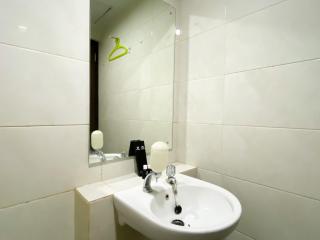 Cozy Studio at 20th Floor Grand Dhika City Apartment By Travelio - Bekasi - 1