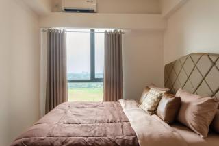 Calma 2BR II at Skyhouse Apartment - Samporo - 9
