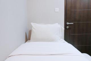 Homey and Cozy 2BR at Mekarwangi Square Cibaduyut Apartment By Travelio - Bandung - 7