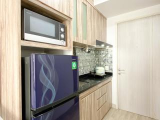 Homey and Compact Studio at Azalea Suites Apartment By Travelio - Cikarang - 3